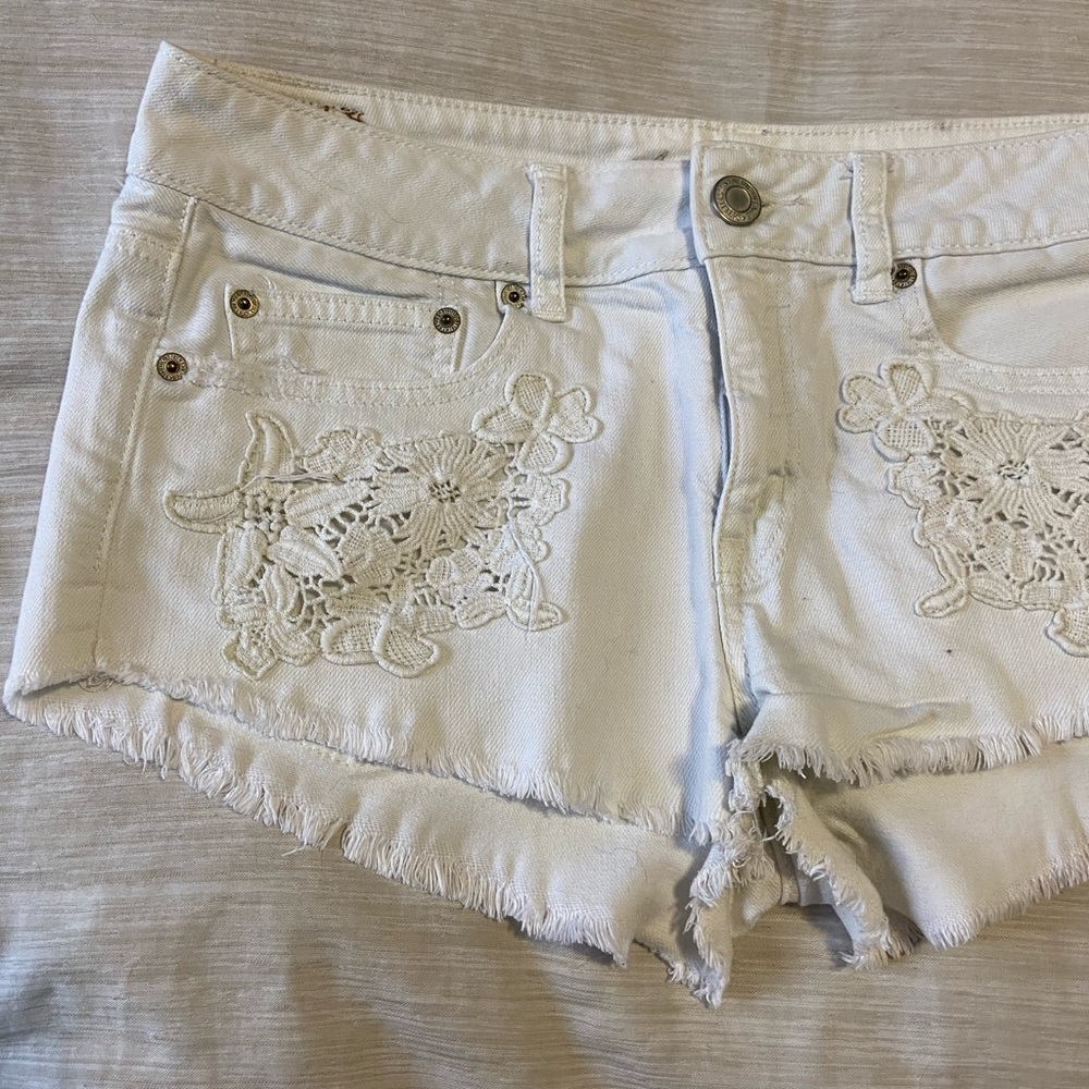 White Jean Shorts with White Floral Pattern